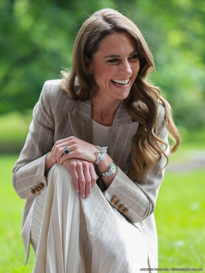 Close-up of Kate Middleton in her Blazé Milano pinstripe blazer with green amethyst Kiki McDonough jewellery.