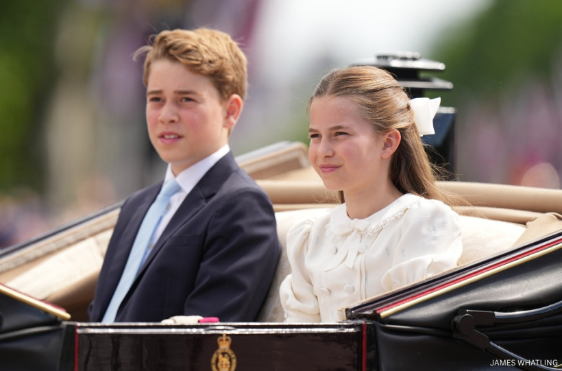 Princess Charlotte and Prince George in the carriage, the boys in navy suits with powder blue ties