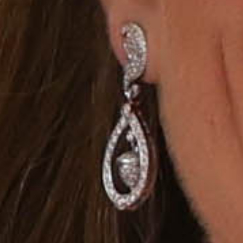 Close-up of Kate Middleton wearing her diamond oak leaf and acorn earrings by Robinson Pelham