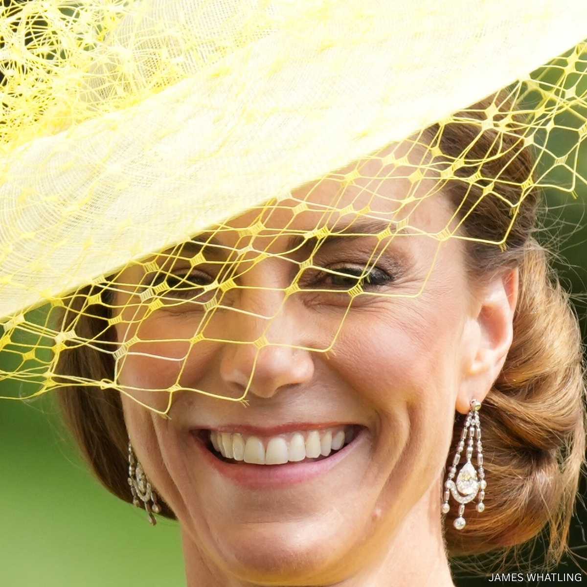 Queen Elizabeth II's chandelier-style diamond earrings, with a large pear-cut diamond suspended in an openwork frame of brilliant and baguette-cut diamonds