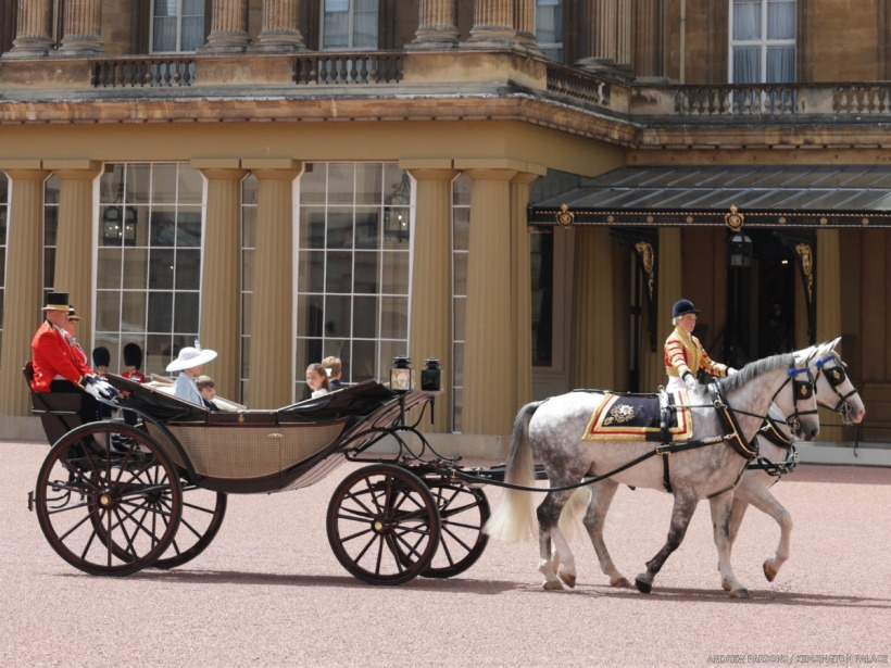 The Princess of Wales and her three children ride in a carriage during the Trooping the Colour procession