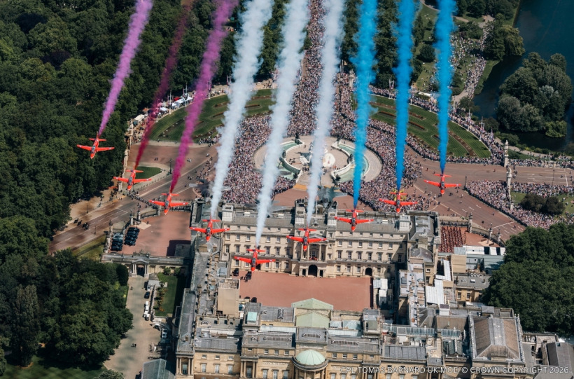 The Red Arrows trail red, white and blue smoke over Buckingham Palace at Trooping the Colour