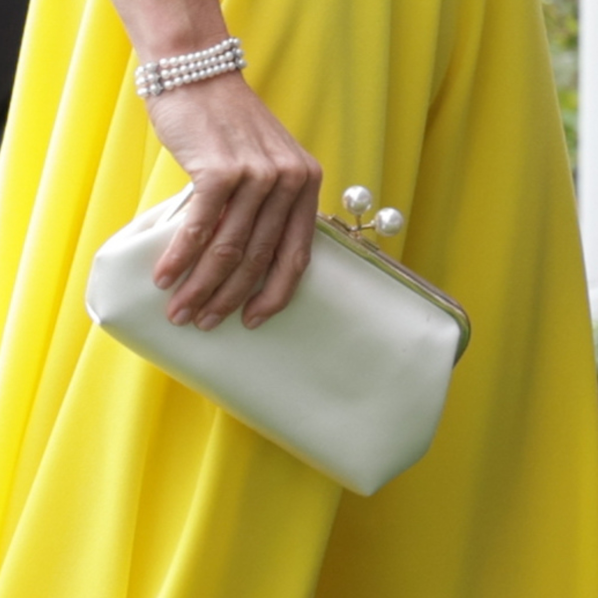 Kate Middleton carrying an ivory satin Anya Hindmarch 'Maud' clutch at Royal Ascot 2026