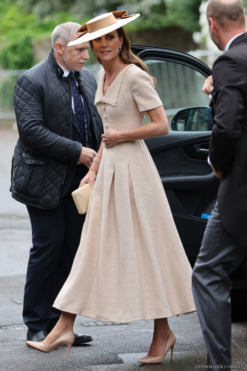 Kate Middleton in a cream Roland Mouret bouclé dress with a matching wide-brimmed hat at a wedding