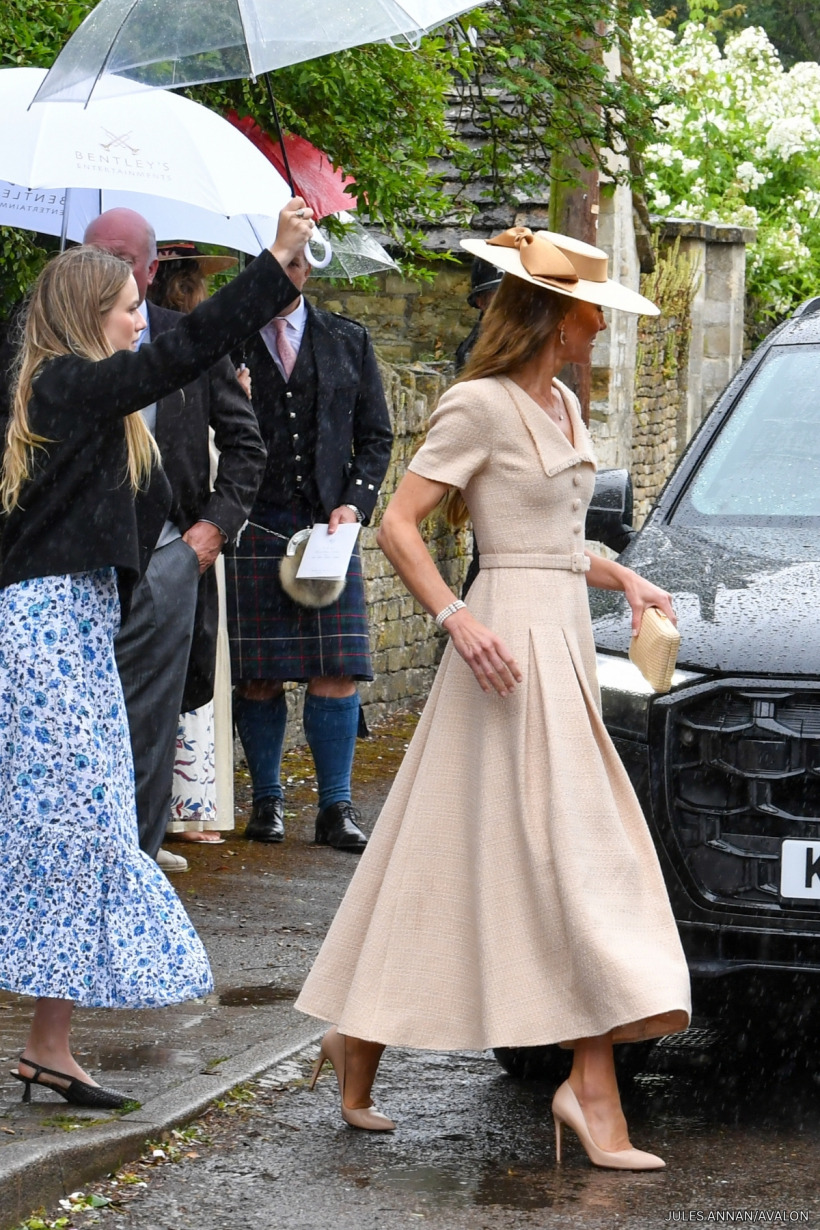 Kate Middleton leaving the church in the rain in her cream Roland Mouret dress