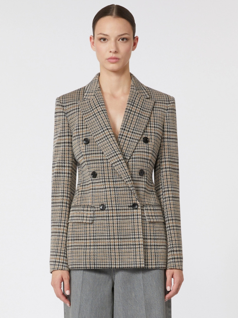 A model wearing the Max Mara grey and brown Glen plaid double-breasted blazer