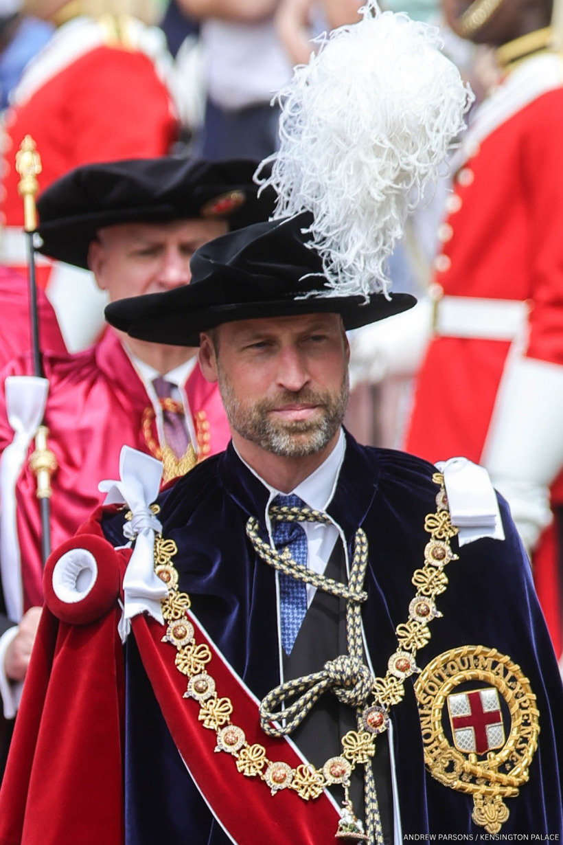 Prince William in the elaborate navy velvet robe and plumed hat of the Order of the Garter