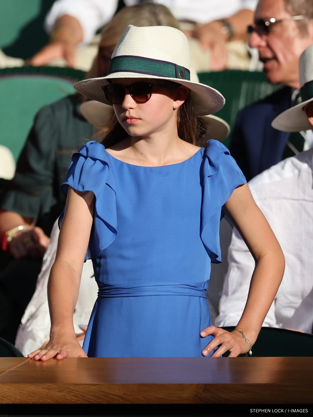 Princess Charlotte in a cobalt blue dress in the Royal Box at Wimbledon