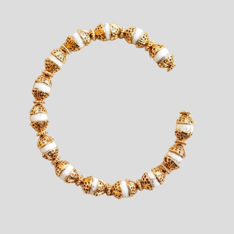 The Sézane 'Stéphanie' cuff strung with white howlite discs capped with gold-plated domes