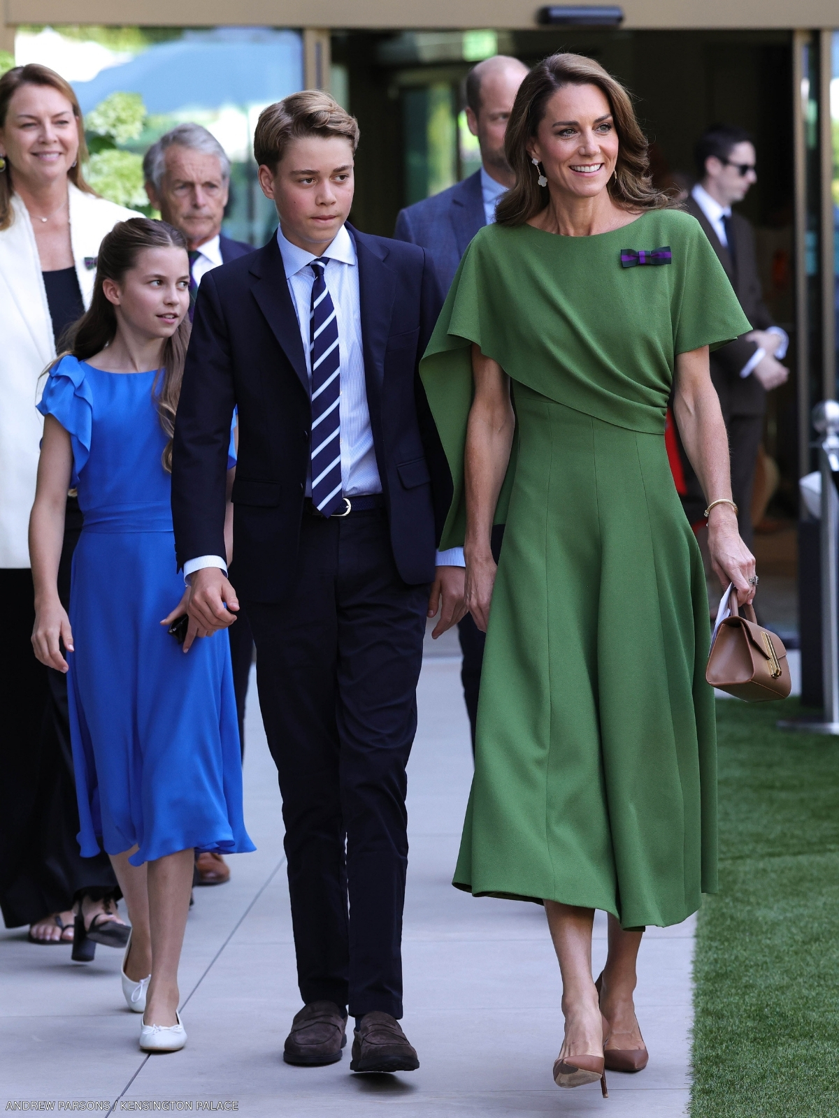 Kate Middleton at Wimbledon wearing the dark green half-cape dress