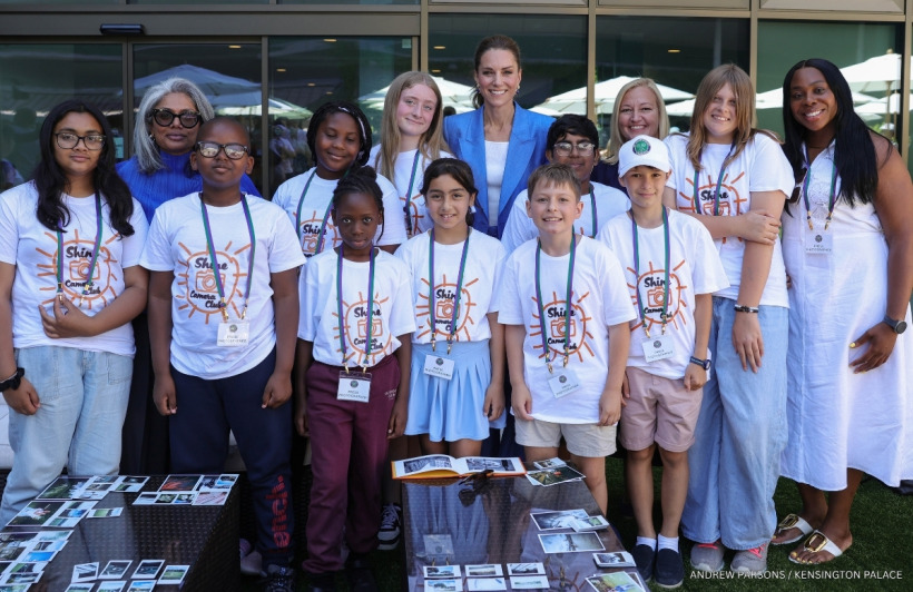 Kate Middleton posing for a group photo with the Shine Camera Club at Wimbledon