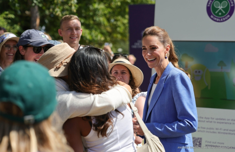 Kate Middleton speaking with members of The Queue at Wimbledon