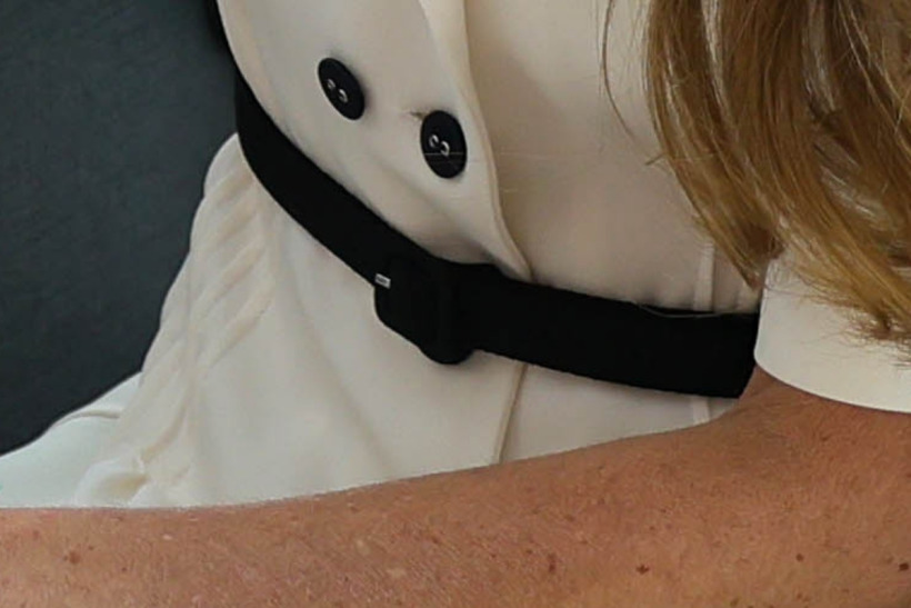 Detail of the slim black belt Kate Middleton wore with her white Suzannah dress