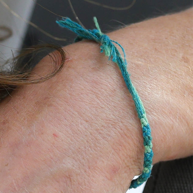 Close-up of the green friendship bracelet Princess Charlotte made for Kate Middleton