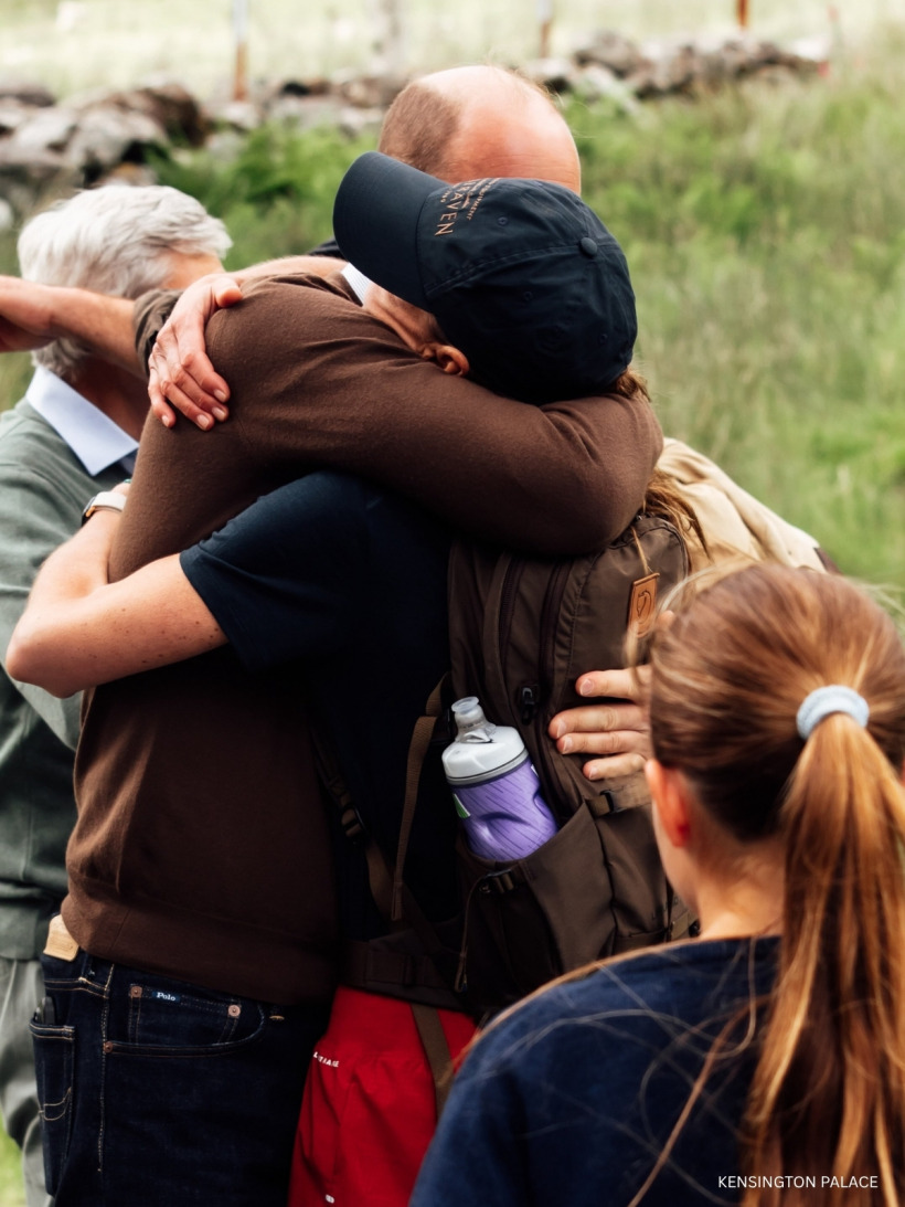 Kate Middleton and Prince William hugging tightly after she completed the Three Peaks Challenge