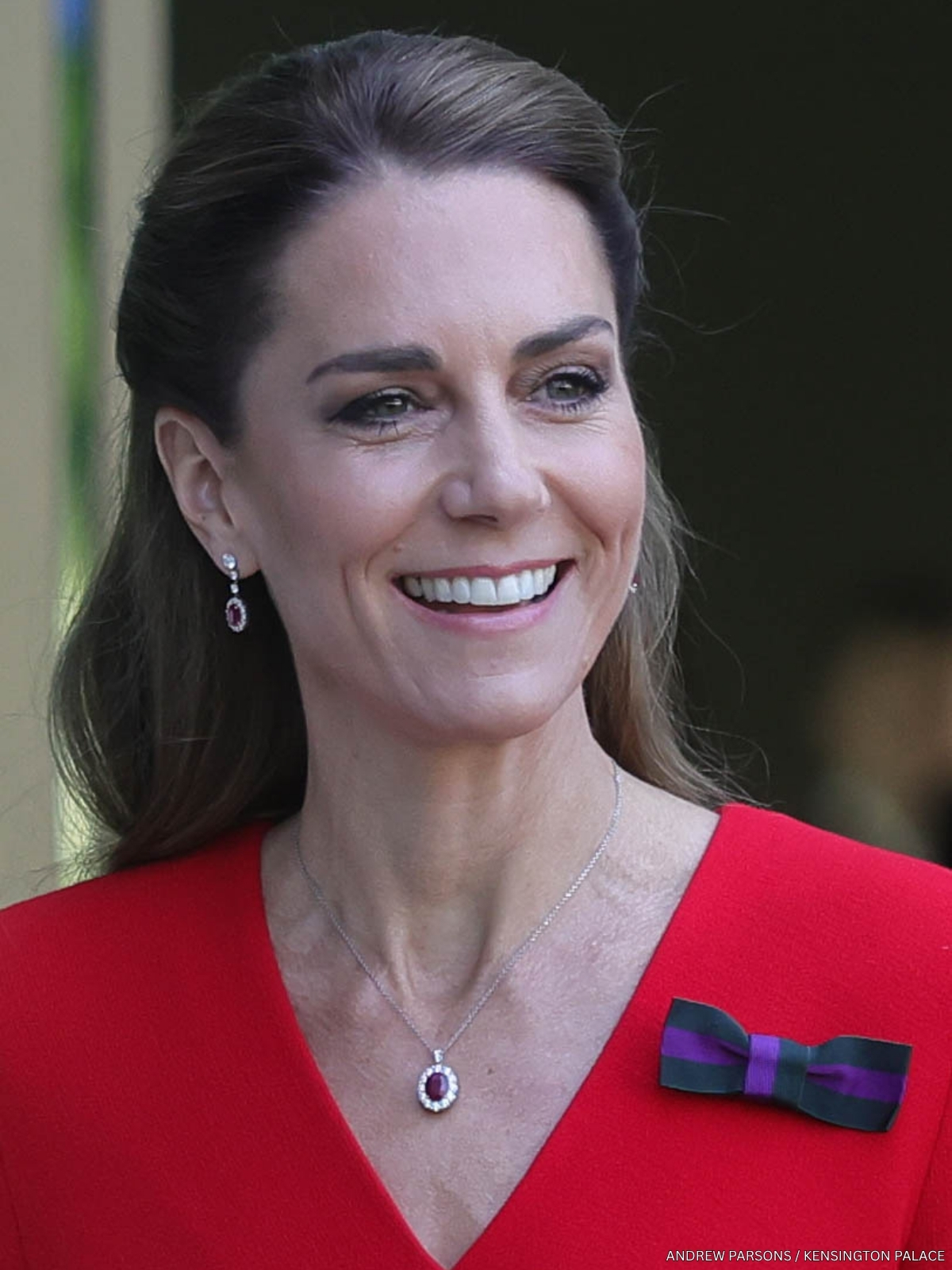 Kate Middleton at Wimbledon, wearing a red dress and ruby jewellery