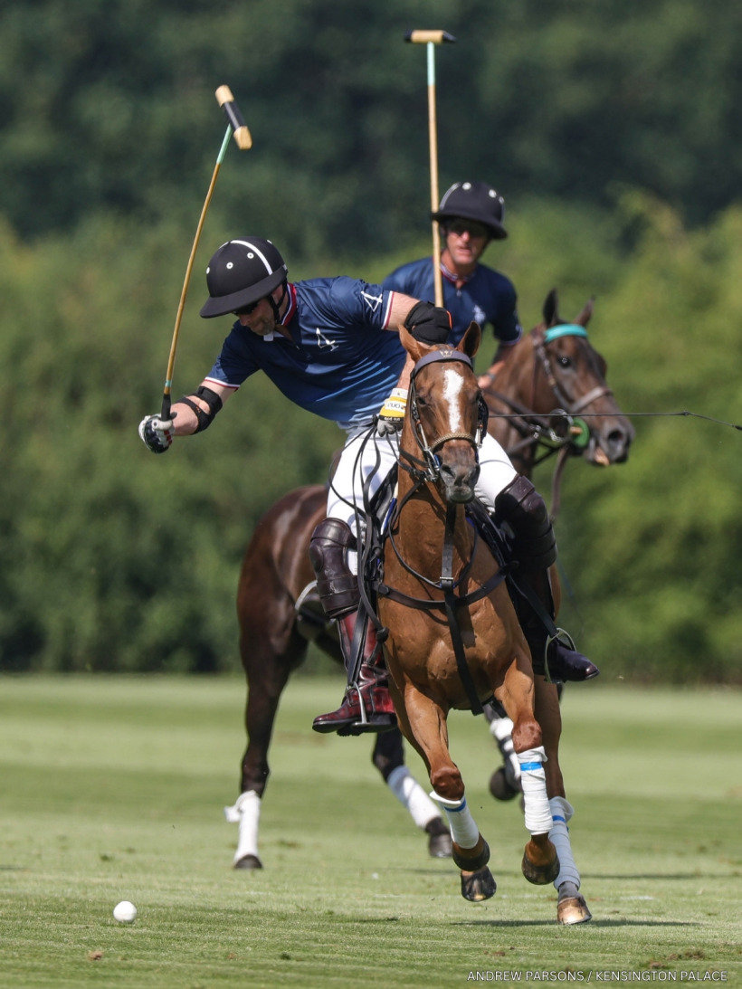 Prince William in his navy jersey playing in the charity polo match
