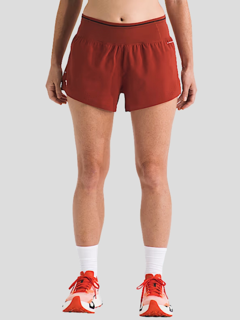 A product shot of The North Face Pacesetter hiking shorts in Iron Clay red