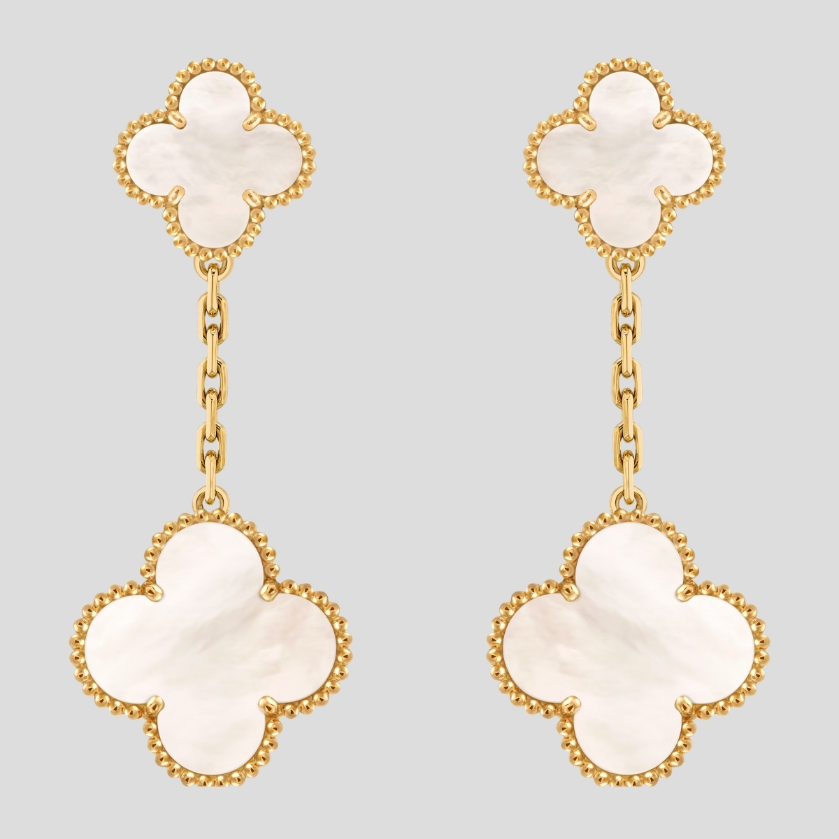 The Van Cleef & Arpels Magic Alhambra two-motif earrings in mother-of-pearl and 18K yellow gold