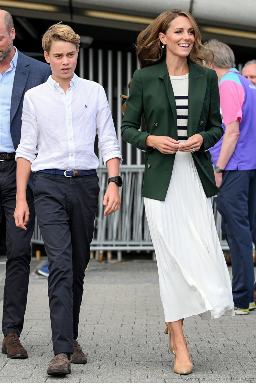 Kate Middleton wearing a green blazer with a pleated white midi skirt at the Commonwealth Games