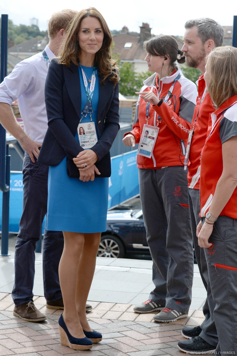 Kate Middleton at a Commonwealth Games in 2014, wearing a blue dress and blue blazer.
