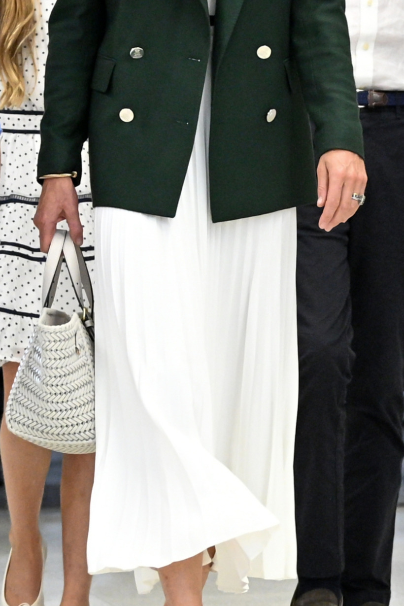 Kate Middleton wearing a pleated white midi skirt at the Commonwealth Games